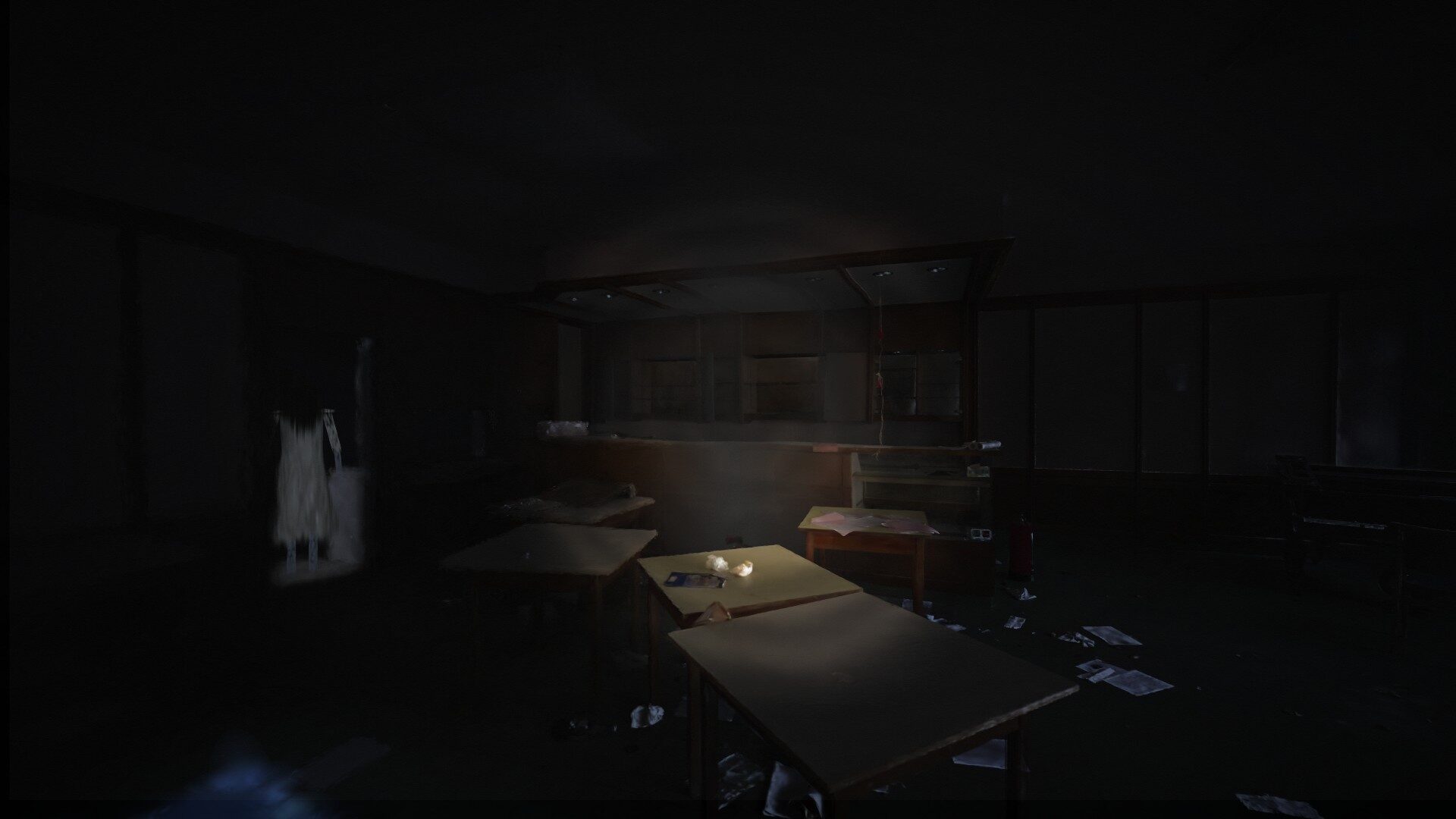 The same dining hall at night, a pale figure standing between the tables